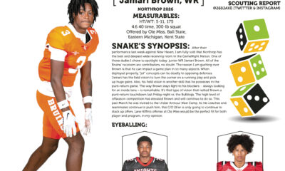 Cycle racer in orange gear with event details on the side.