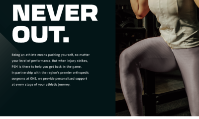 Motivational fitness poster with "Not Down. Never Out." text and woman exercising.