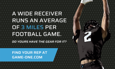 Wide receiver catches a football during a game.