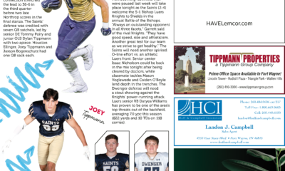 Football player in yellow helmet running with ball, coach and players below.