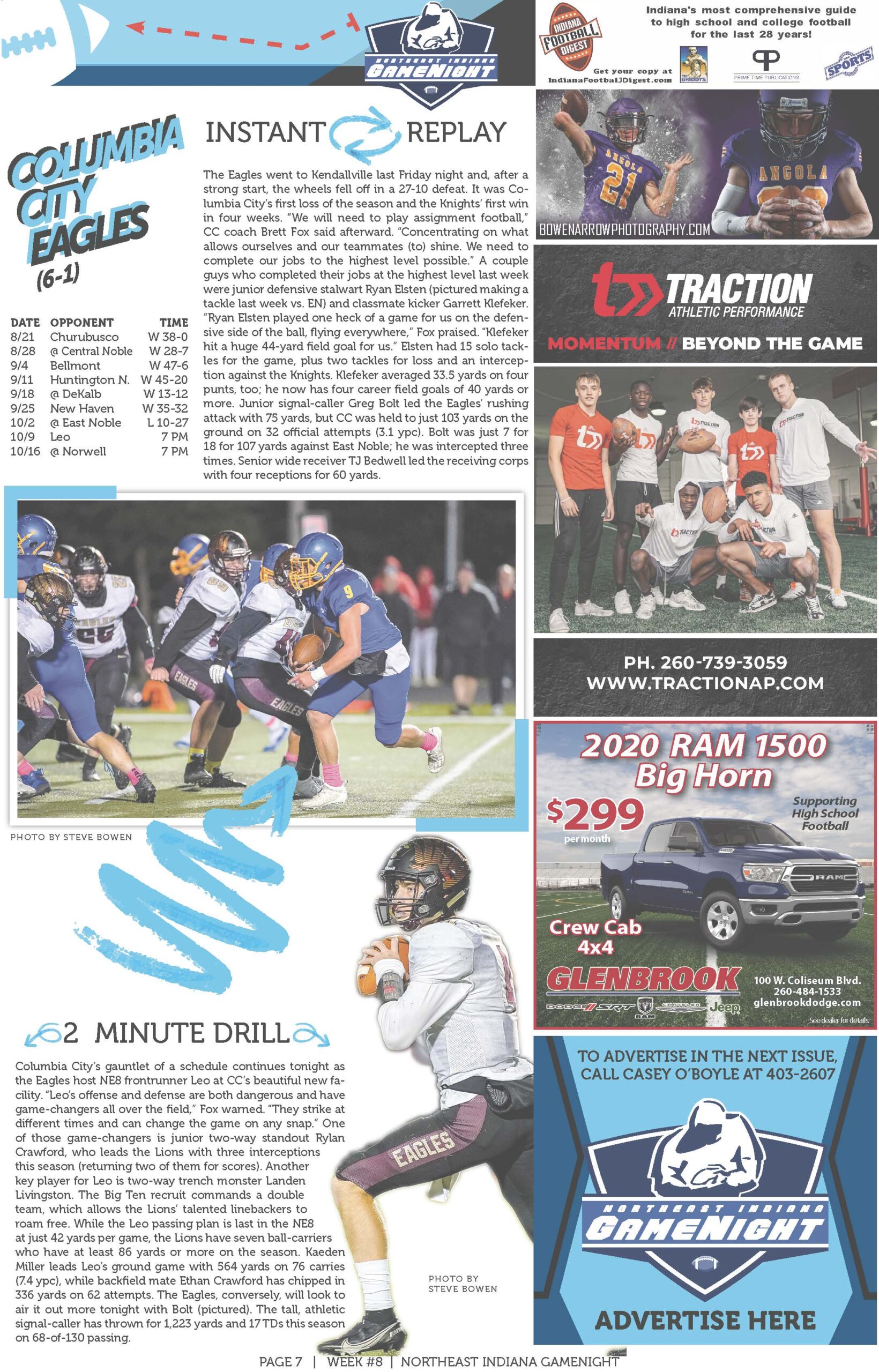 High school football game action with players tackling and a coach observing.