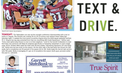 Football players celebrate a touchdown with a text and drive safety message.