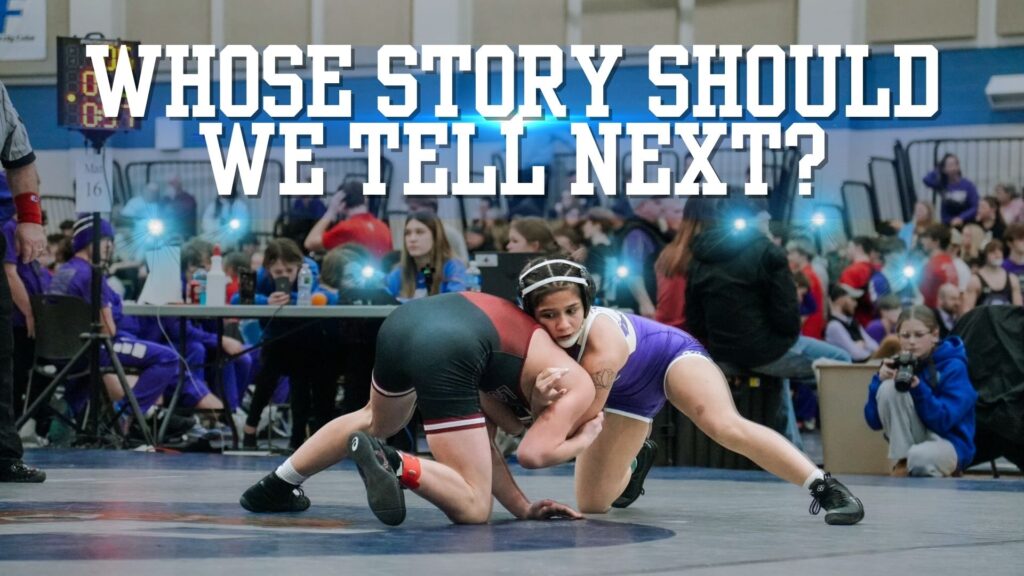 Wrestlers competing in a crowded gymnasium.